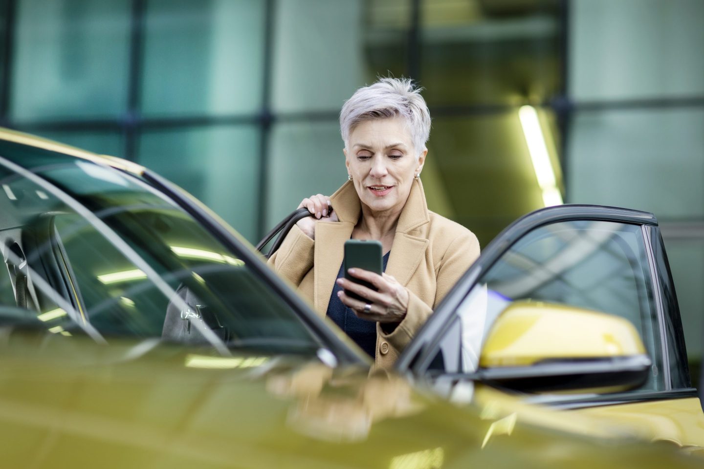 Wealth looking woman opening her car