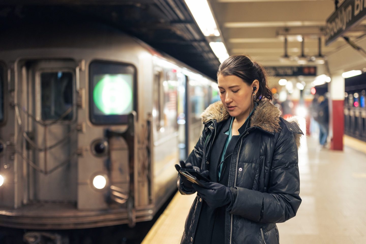 A woman in a New York City subway station heads home after work