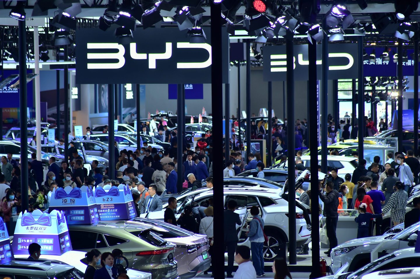 People visit the booth of BYD, a surging Tesla rival in China, during the 2023 Shenyang International Auto Show on May 3.