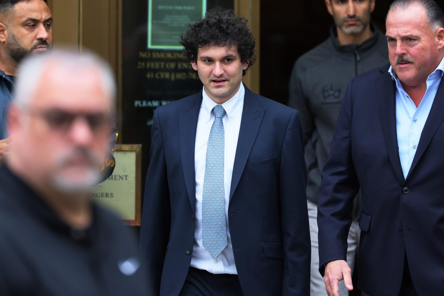 man in suit and tie leaving courthouse