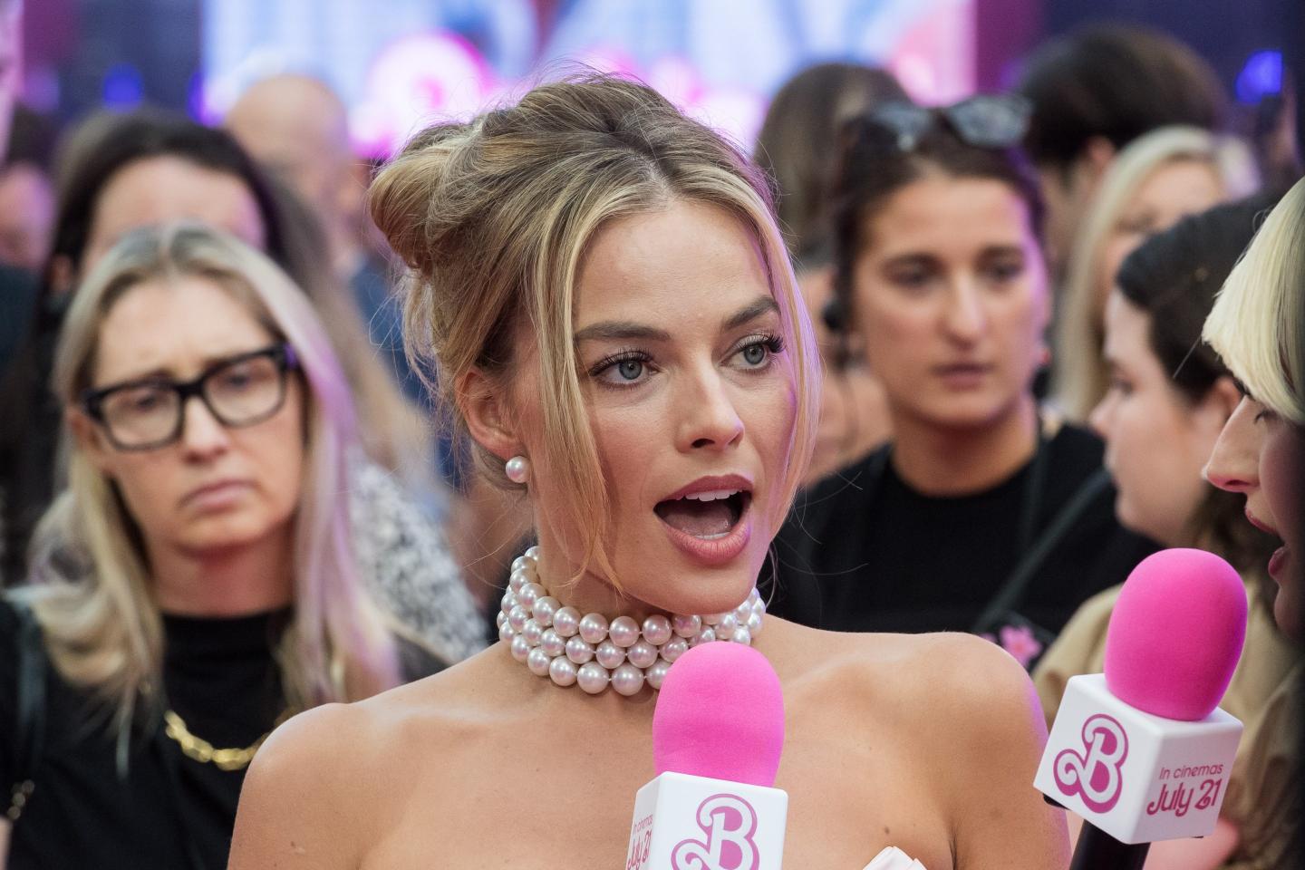 Margot Robbie giving an interview at the European premiere of the Barbie movie.