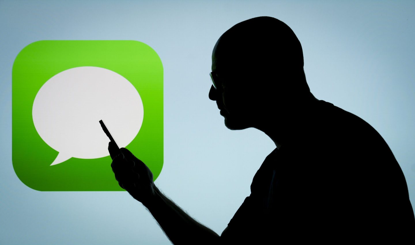 The Apple iMessage app and logo are seen in this photo illustration