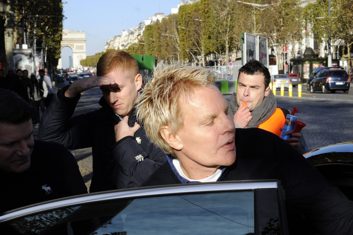 Mike Jeffries, CEO of Abercrombie & Fitch, leaves the store on the Champs Elysees avenue in Paris.