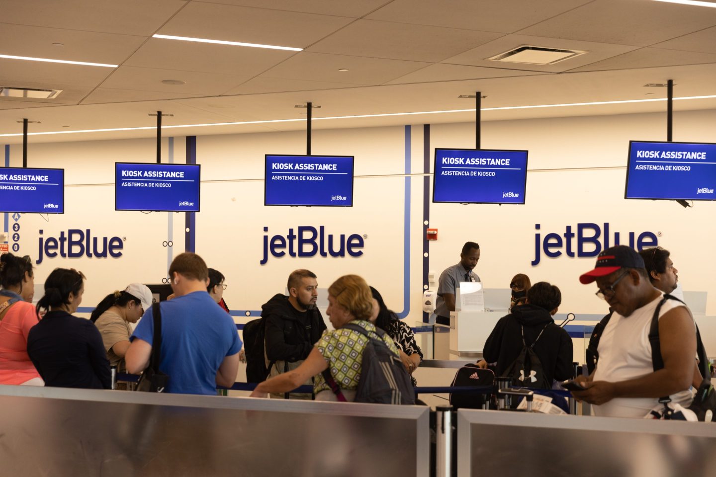 Travelers on JetBlue flights at John F. Kennedy International Airport in New York.