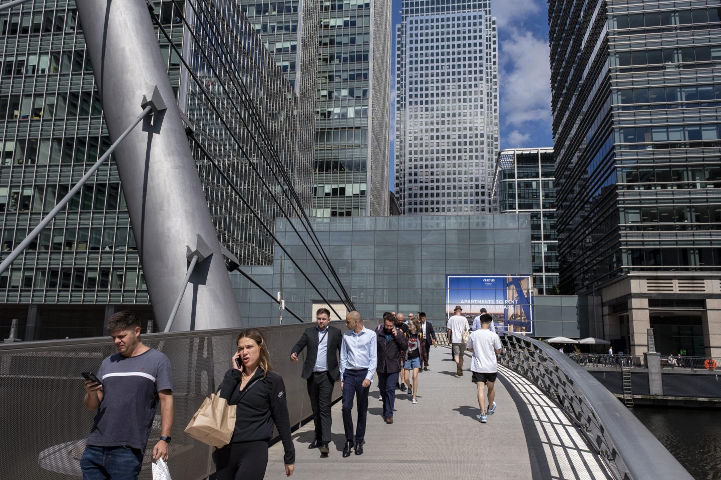People walking on a busy bridge in London