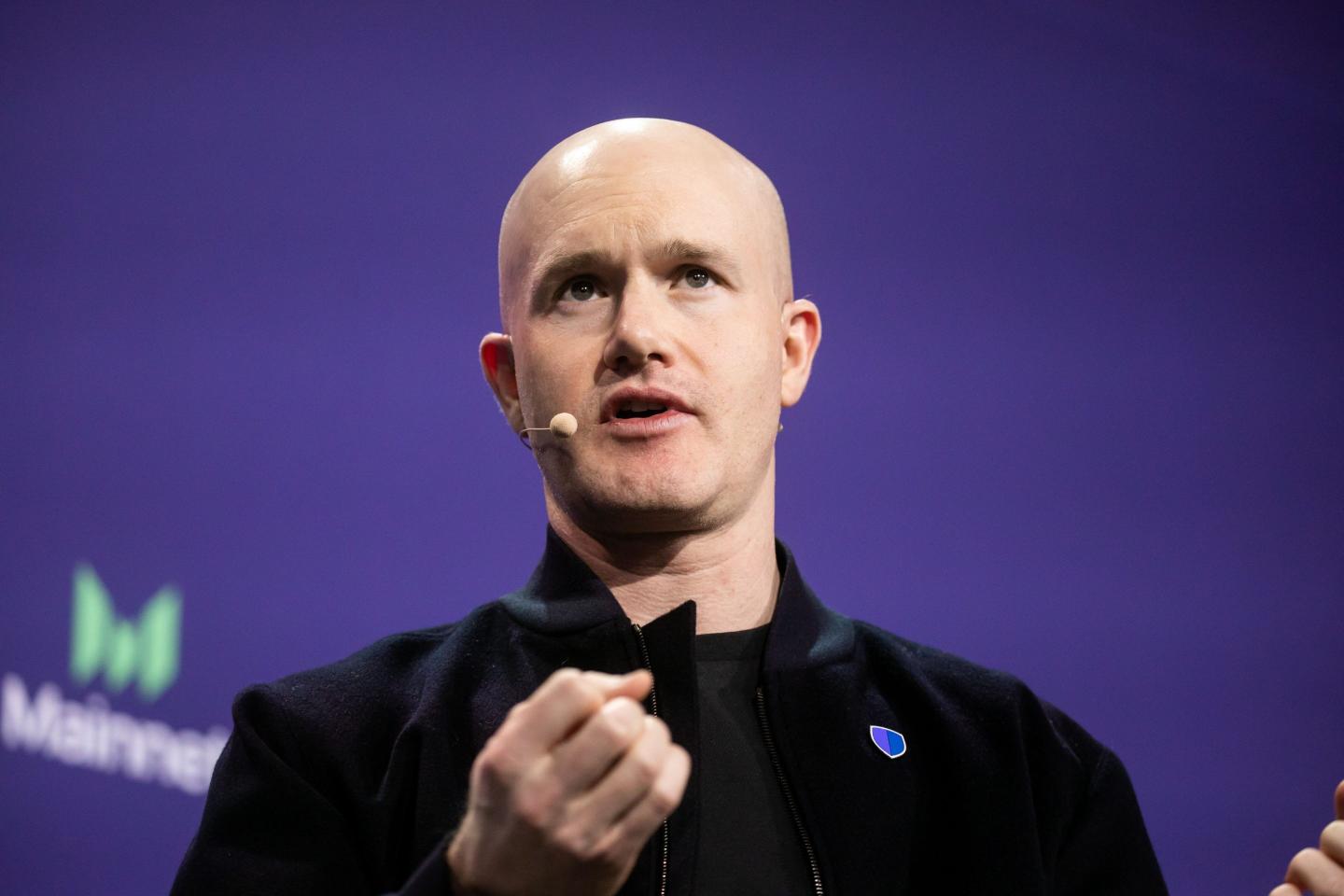 Brian Armstrong speaks at a crypto conference in NYC.