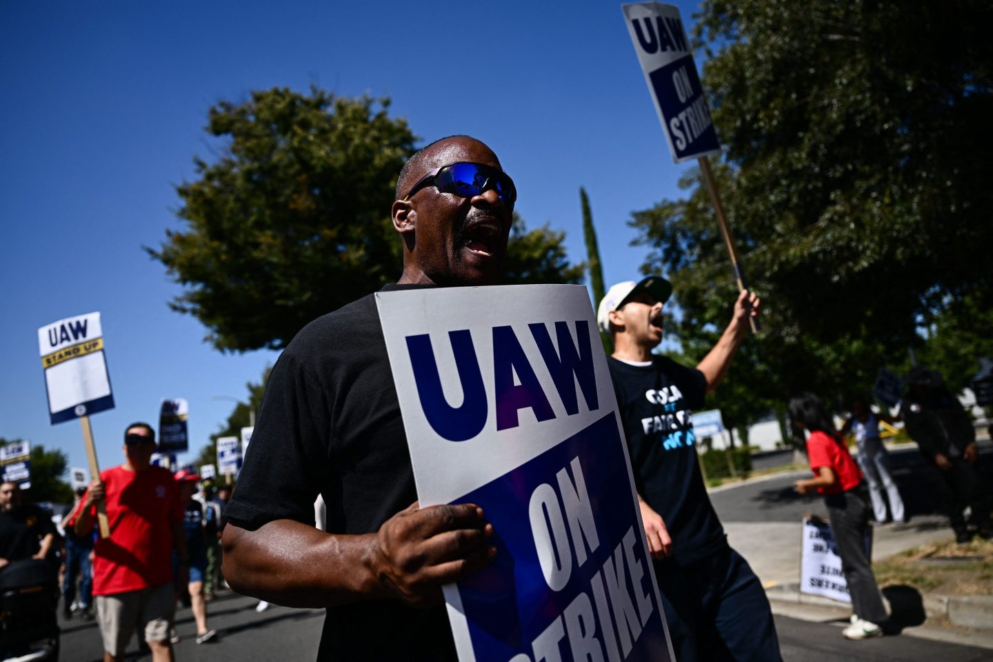United Auto Workers members and supporters on a picket line outside the Stellantis Chrysler Los Angeles Parts Distribution Center in Ontario, California, in September.