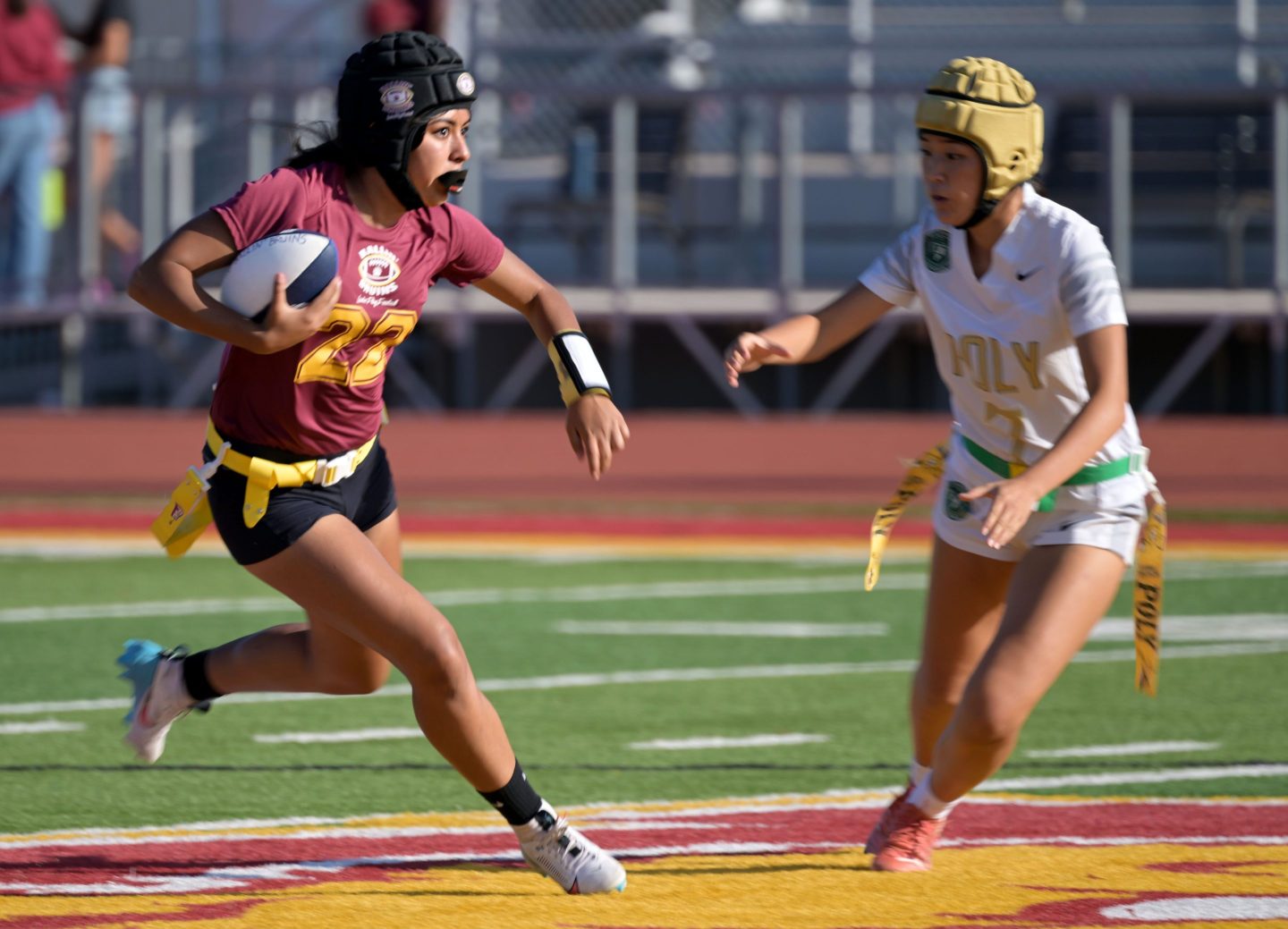 Two people playing flag football