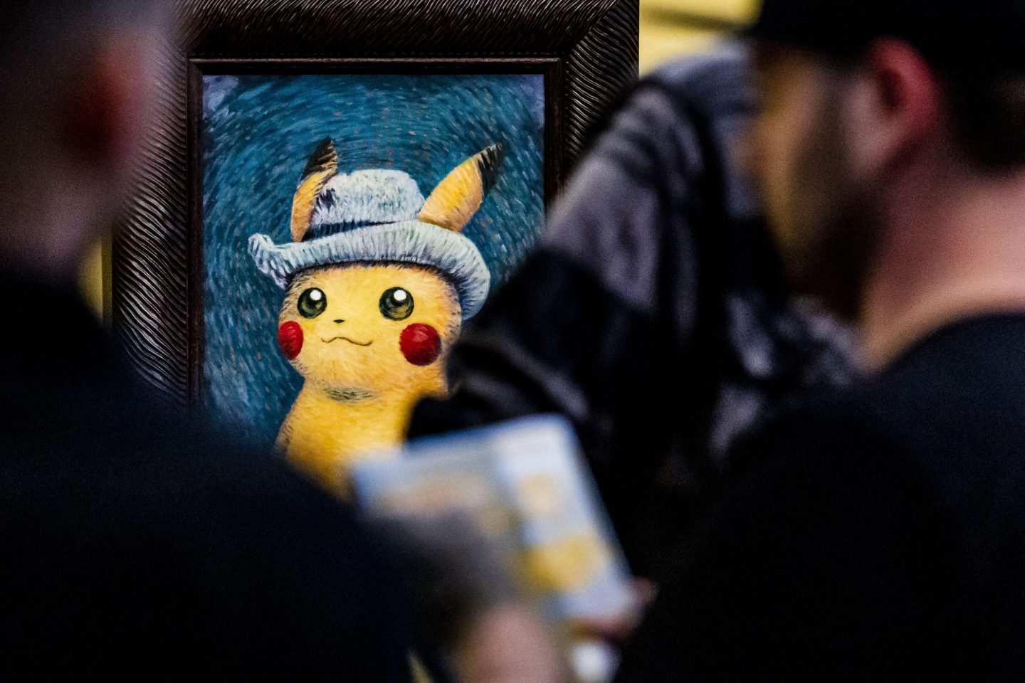 Visitors attend an exhibit of Pokémon paintings inspired by van Gogh at the Amsterdam museum that bears his name.