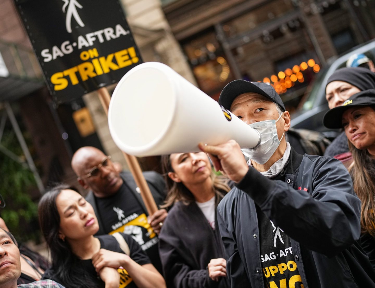 Perry Yung joins SAG-AFTRA members on strike 2023 in New York City. The union has been on strike since July 14.