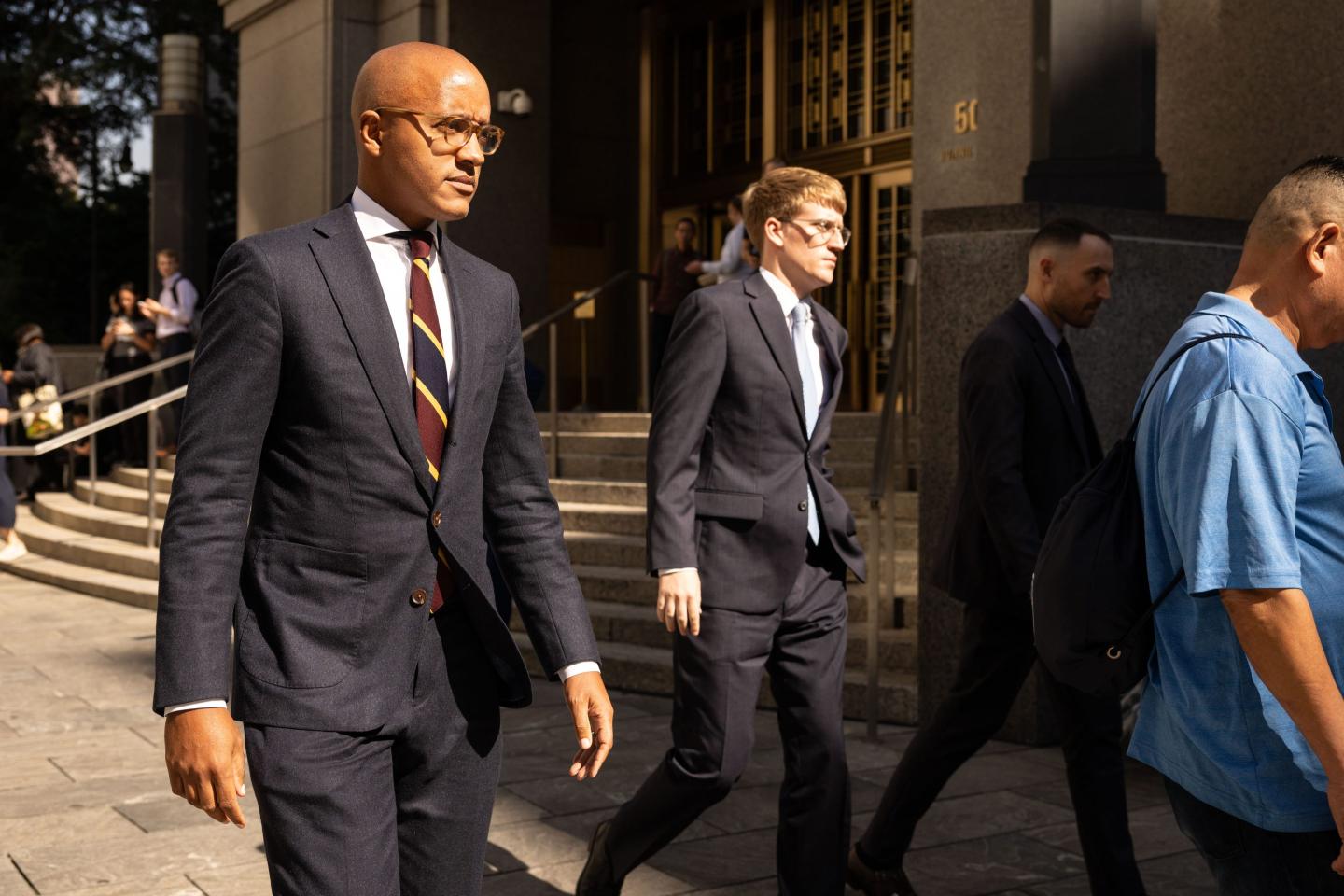 Damian Williams, U.S. attorney for the Southern District of New York, left, exits the courthouse where Sam Bankman-Fried is being tried.