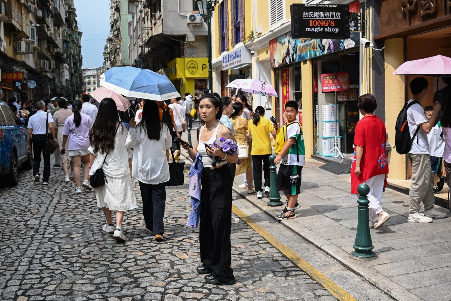 A Chinese tourist standing amid a crowd in Macau.