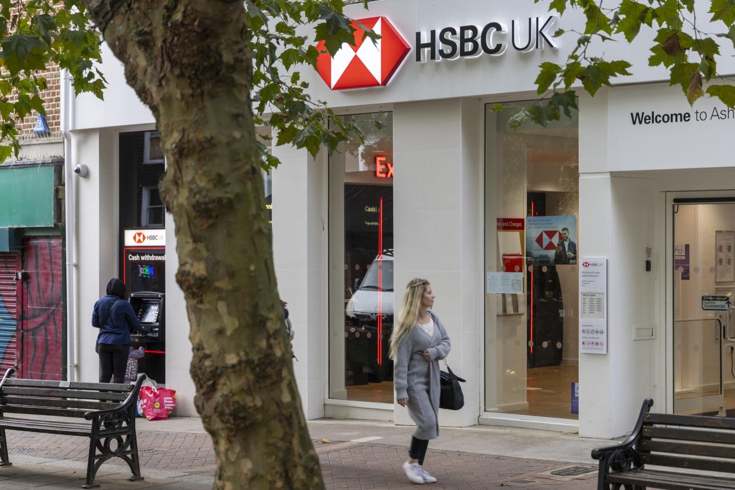 people shown outside an HSBC UK bank branch