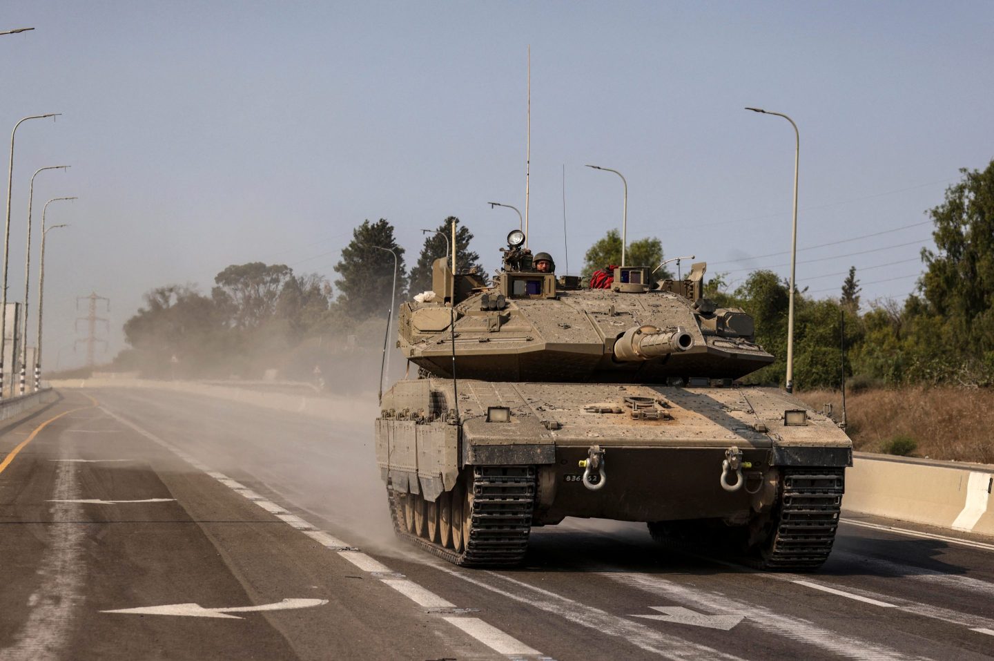 An Israeli tank near the southern city of Sderot on Sunday. Israel's prime minister warned of a "long and difficult" war.