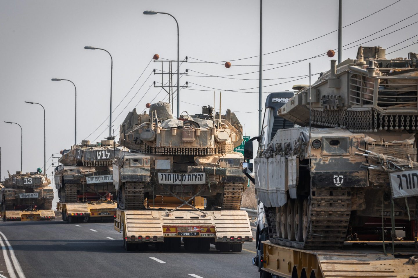 Israeli military vehicles on Sunday after Palestinian militants launched more rockets at border towns.
