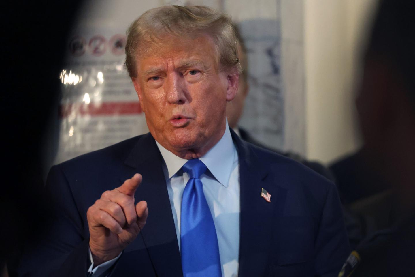 Former President Donald Trump speaks to the media after leaving a New York State Supreme court after the start of the civil fraud trial against him