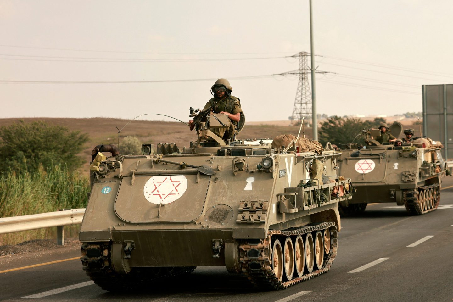 Israeli soldiers ride in their armored vehicles towards the border with the Gaza Strip on October 16, 2023, amid the ongoing battles between Israel and the Palestinian group Hamas.