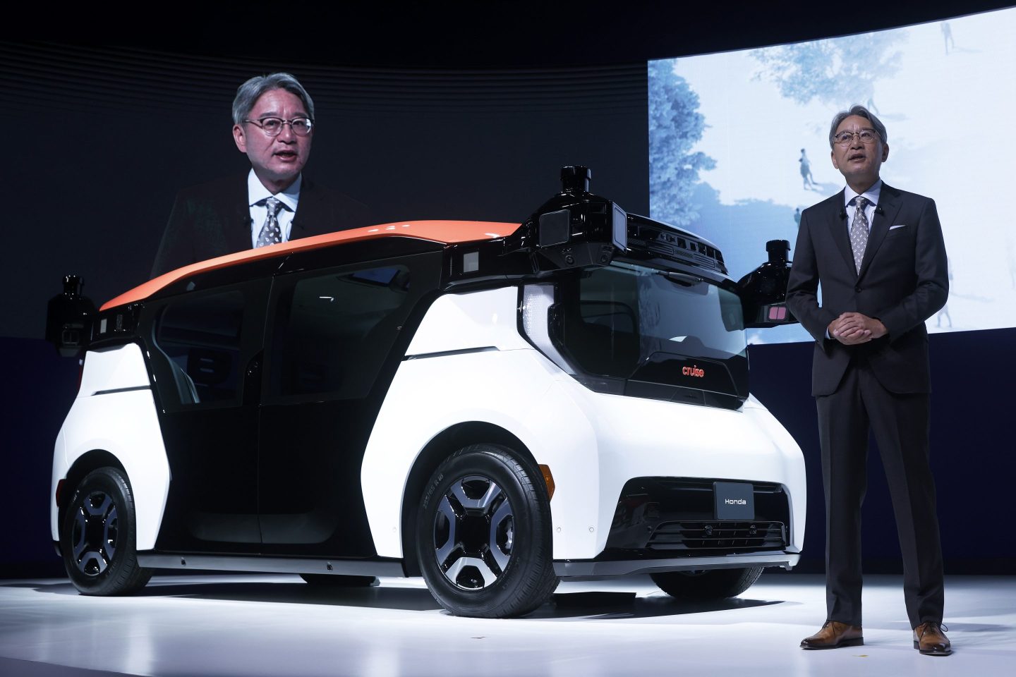 Toshihiro Mibe, president and chief executive officer of Honda Motor Co., speaks next to the company's Cruise Origin at the Japan Mobility Show in Tokyo, Japan, on Oct. 25, 2023.