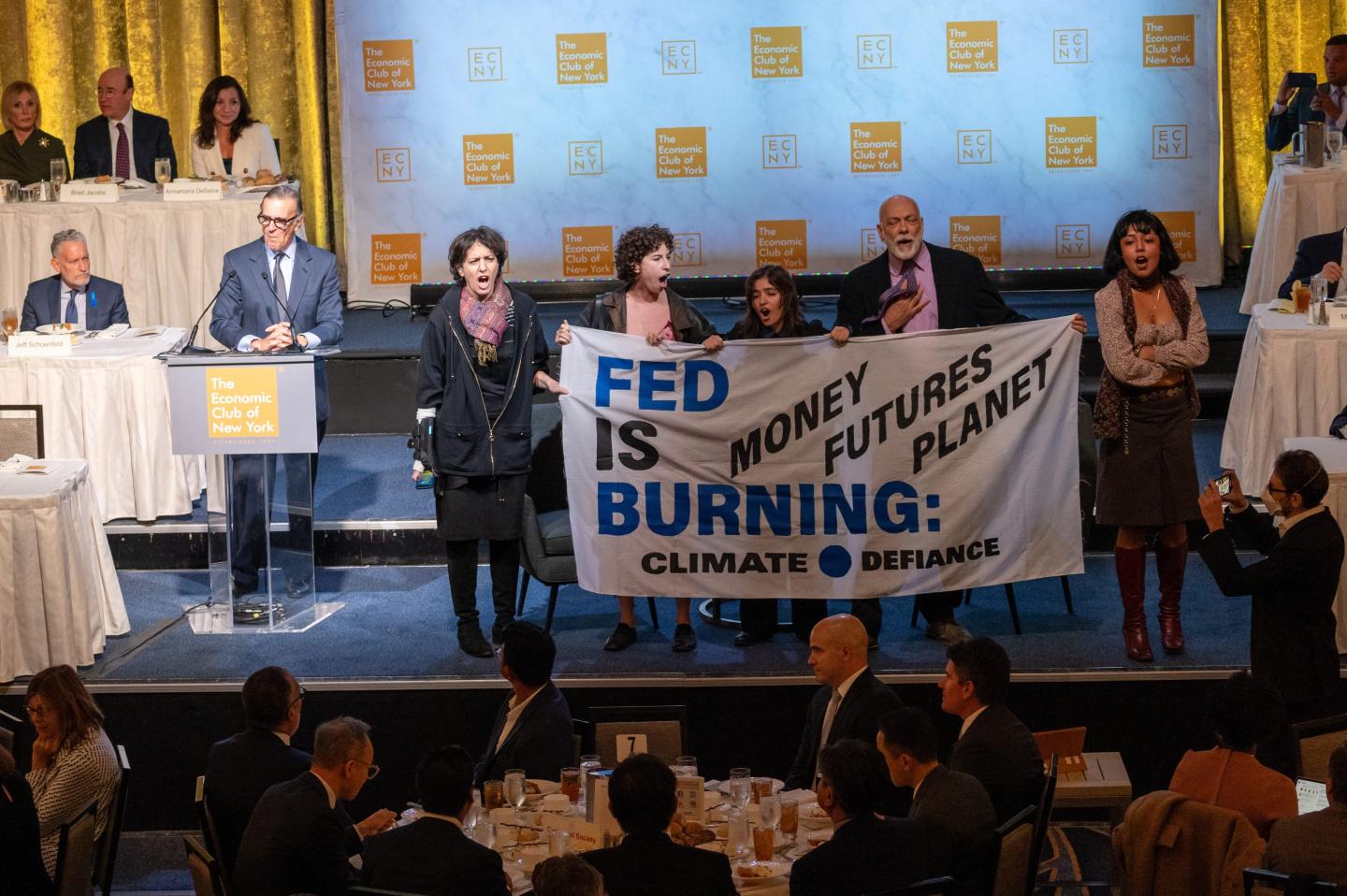 Climate protesters crash Jerome Powell’s press conference, chanting ‘Stop fossil finance’