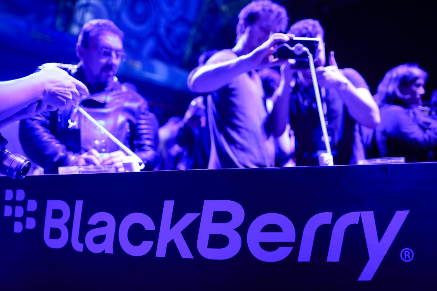 Attendees look at the Blackberry Keyone smartphone, during its launch event ahead of the Mobile World Congress in Barcelona, Spain, on Feb. 25, 2017.
