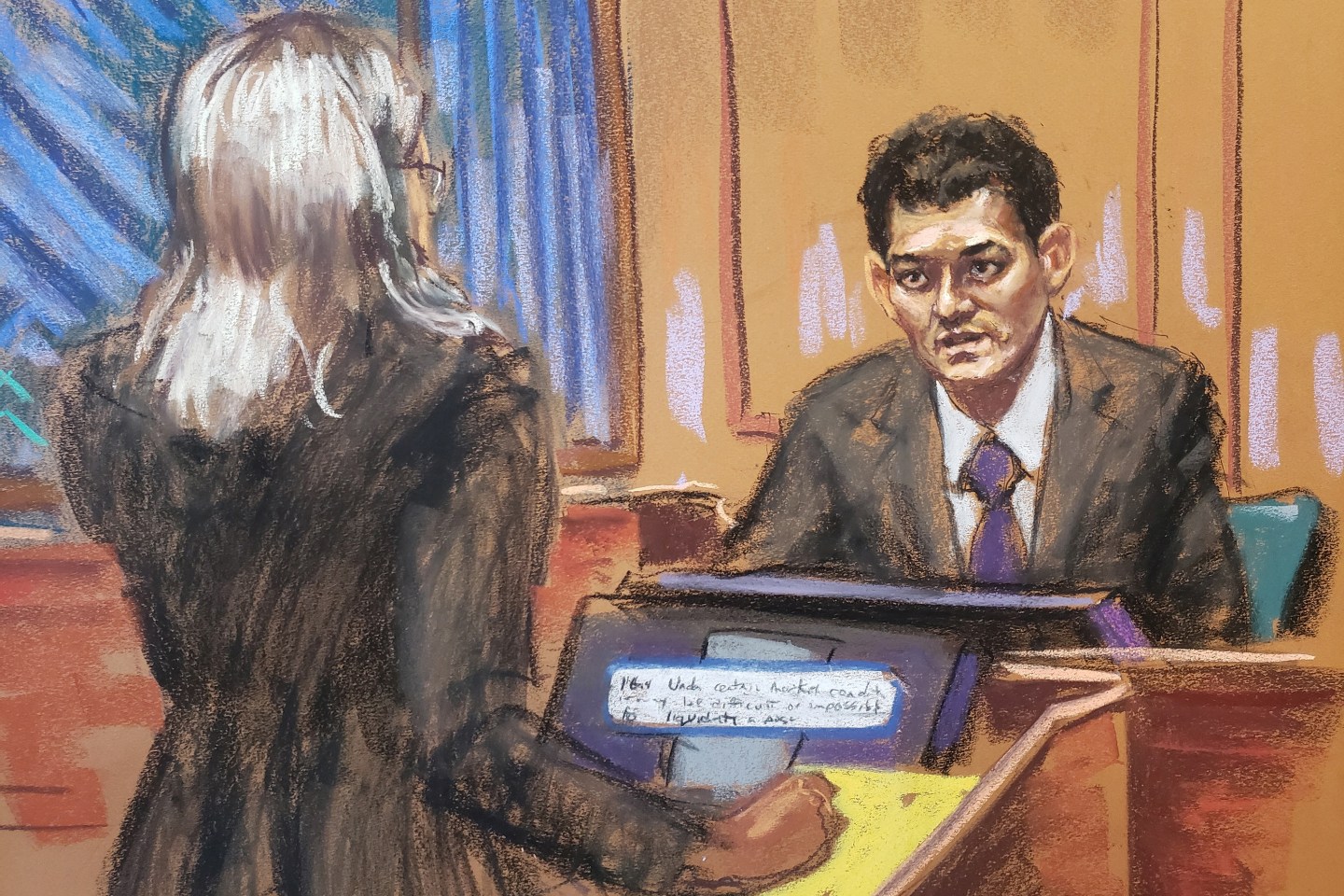 FTX founder Sam Bankman-Fried is questioned by Assistant U.S. Attorney Danielle Sassoon as he testifies in his fraud trial at federal court in New York City.
