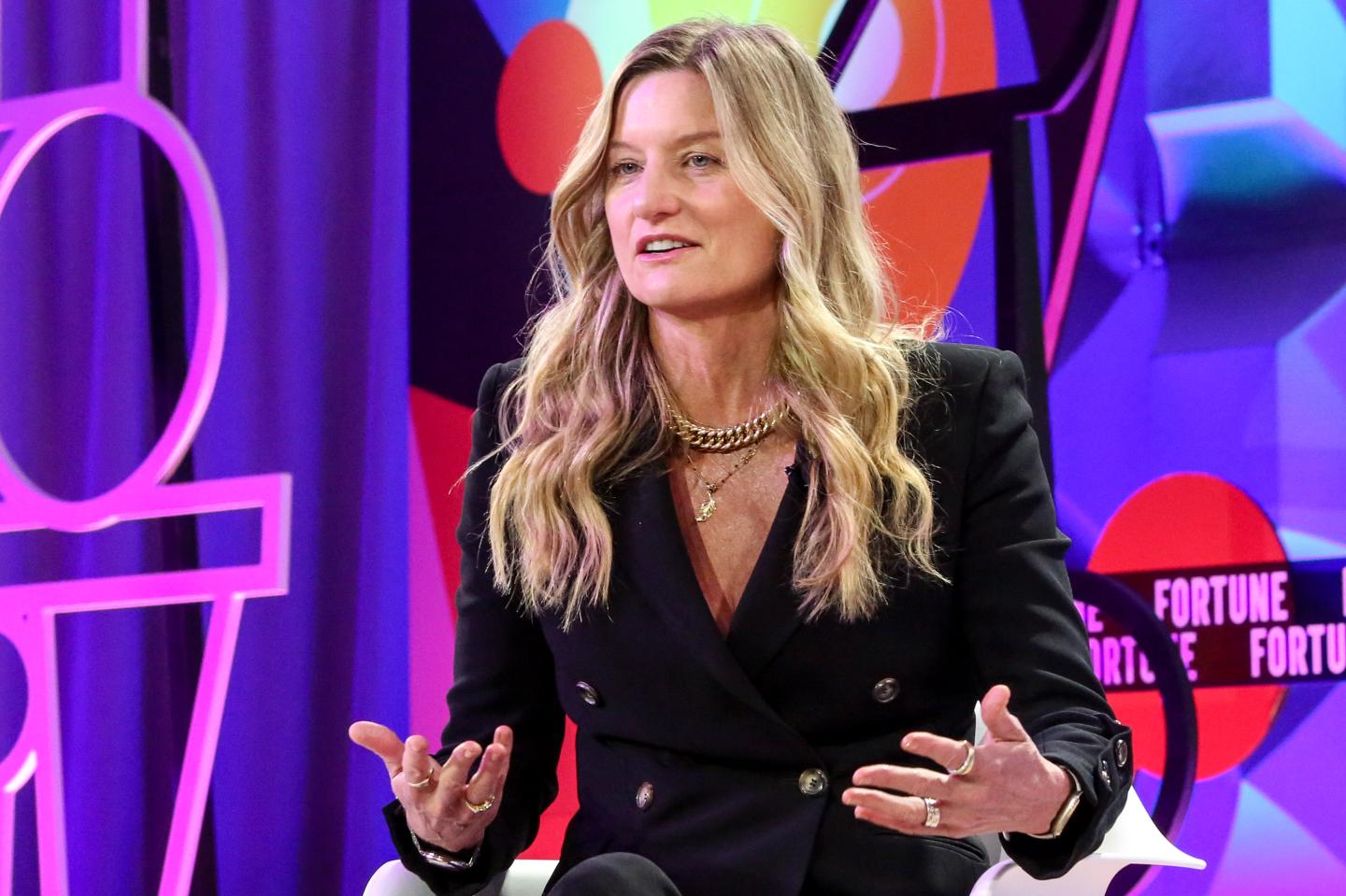 businesswoman speaking onstage