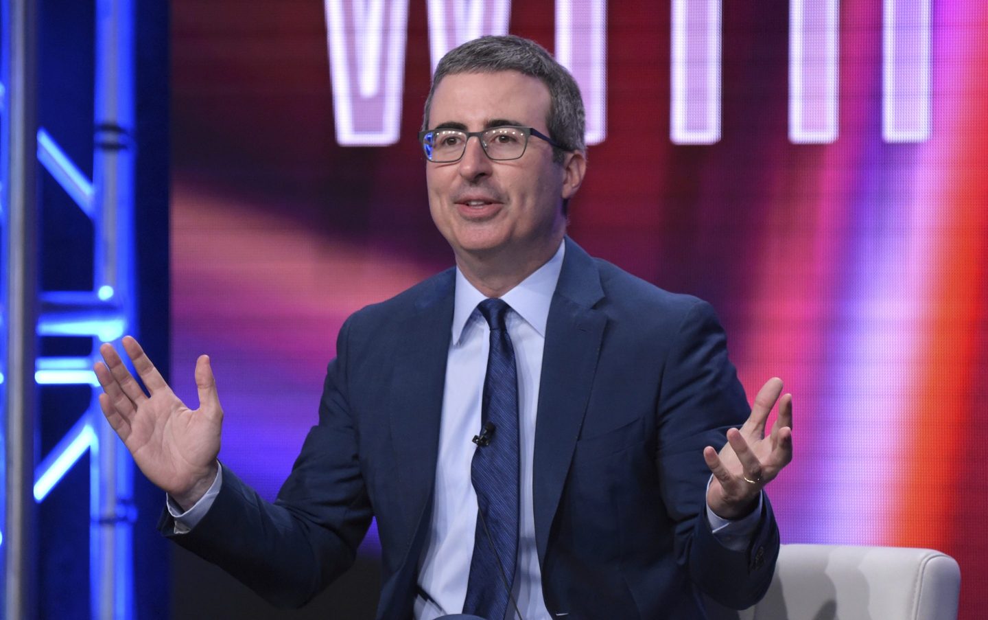 John Oliver speaking and gesturing