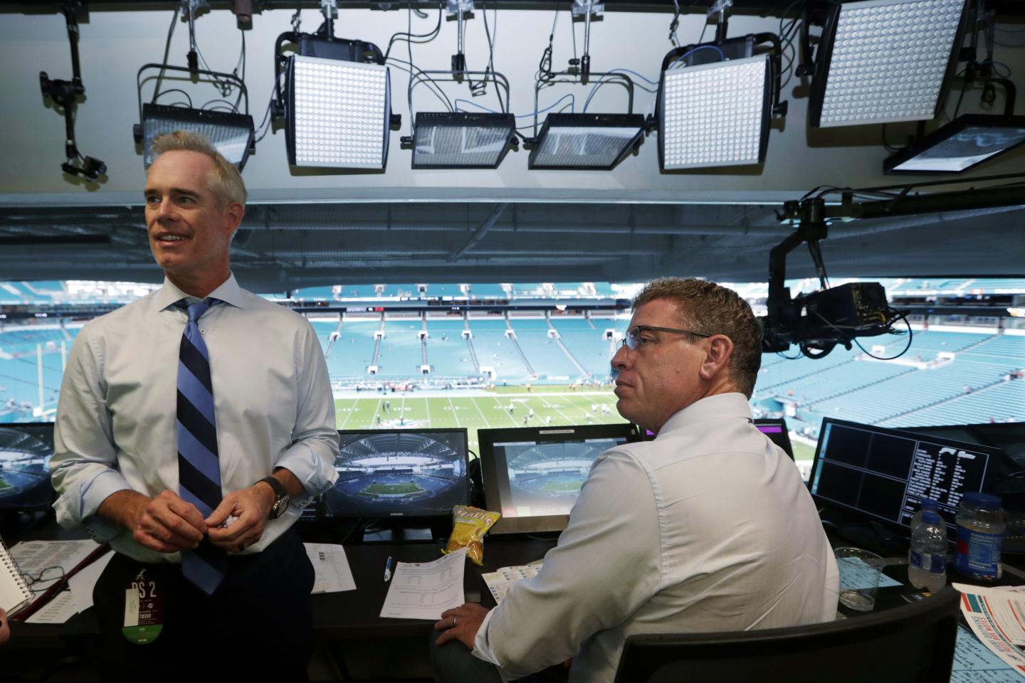 Joe Buck and Troy Aikman in a broadcast booth