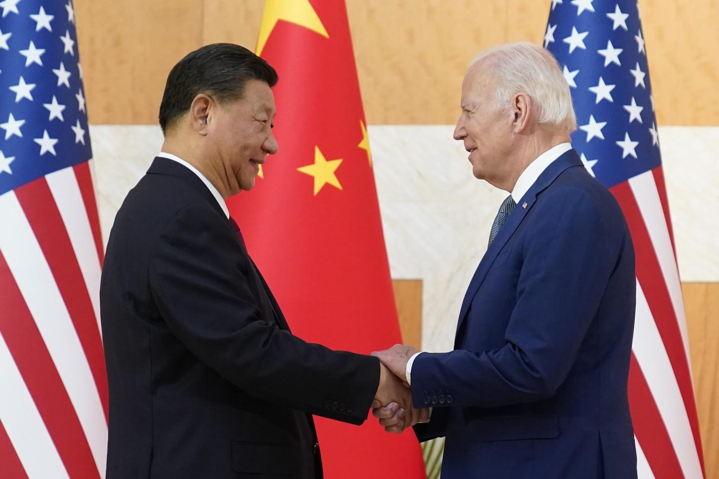President Joe Biden and Chinese President Xi Jinping shaking hands