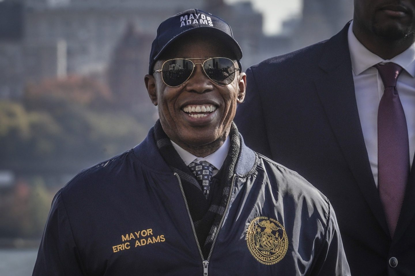 NYC Mayor Eric Adams wearing sunglasses and smiling