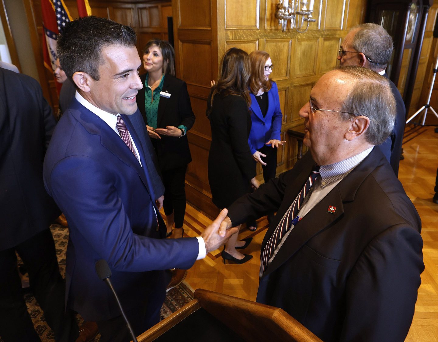 Patrick Howarth, left, global business manager, low carbon solutions for ExxonMobil, shakes hands with Sen. Mark Johnson, R-Little Rock, after an announcement of a new lithium extraction operations to start soon in south Arkansas, on Nov. 13, 2023, at the state Capitol in Little Rock.