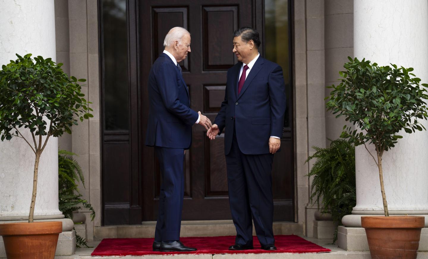 U.S. President Joe Biden and Chinese President Xi Jinping shaking hands