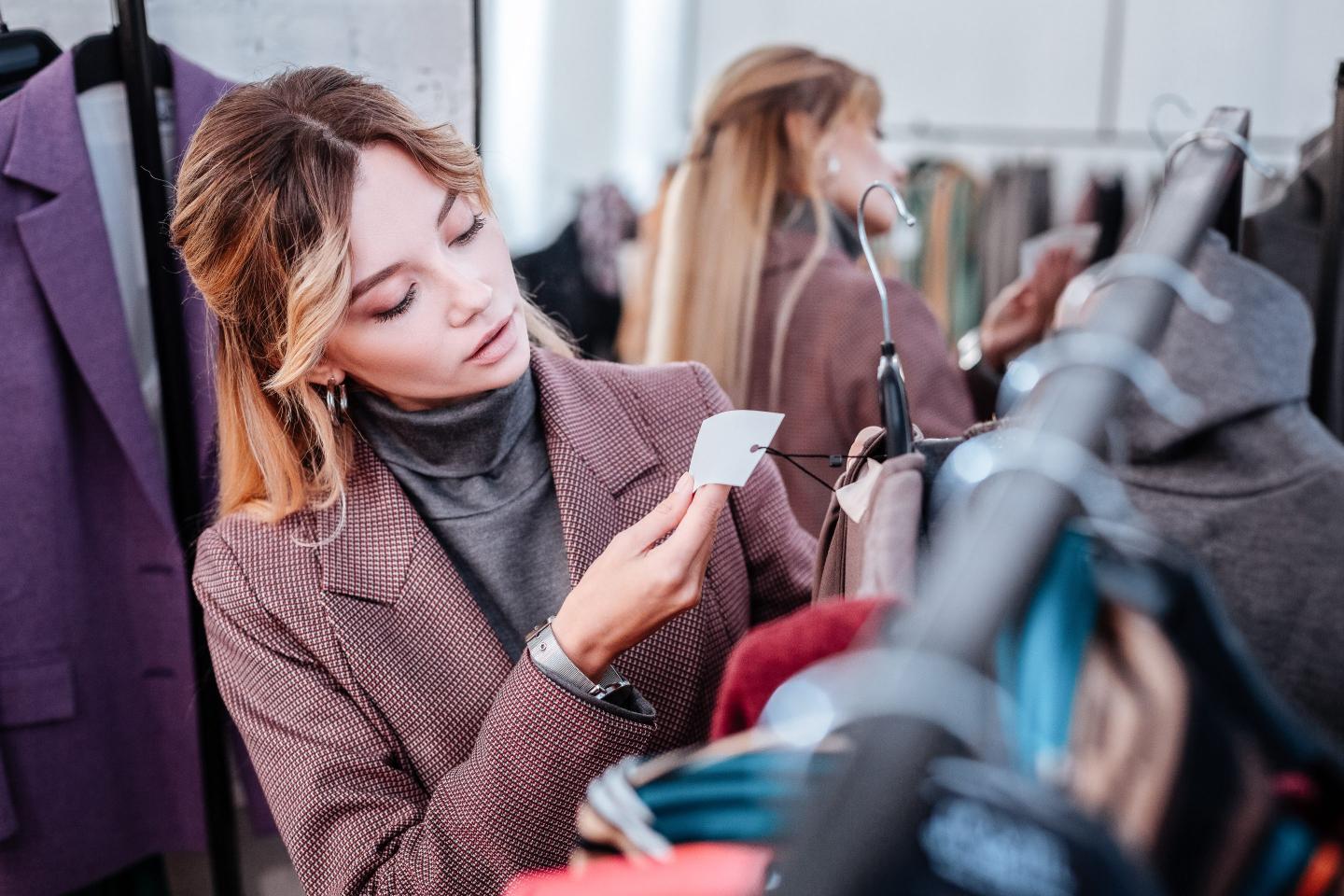 businesswoman shopping checking the price of dress