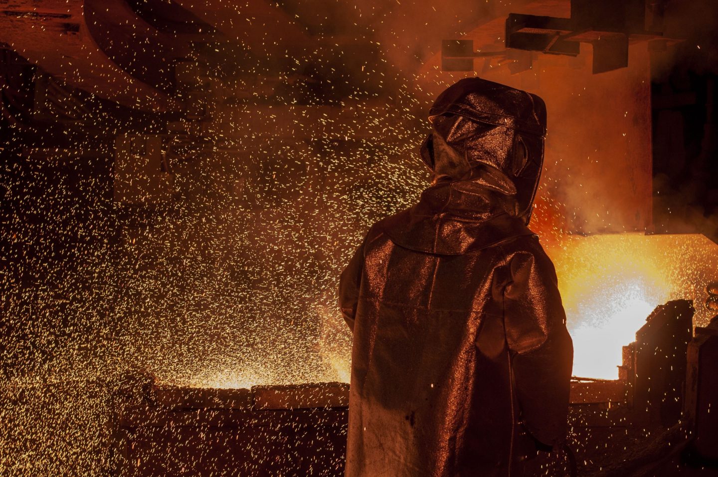 Workers issue nickel ore in the furnace process .