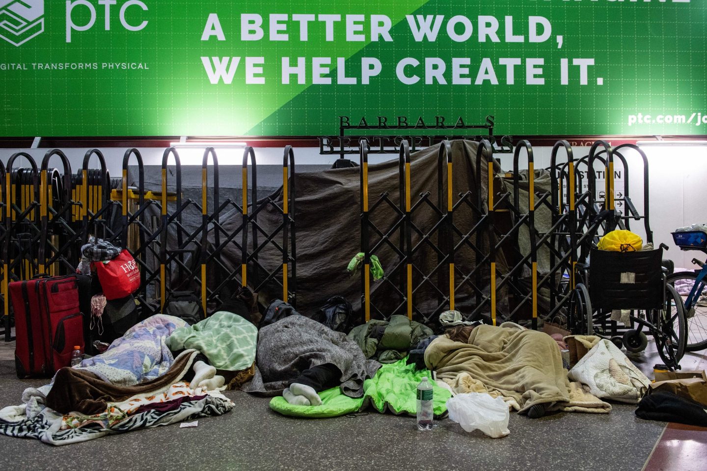 Homeless people stay warm at South Station, Boston, on February 4, 2023, when temperatures dropped to -7 Fahrenheit (-14 Celsius).