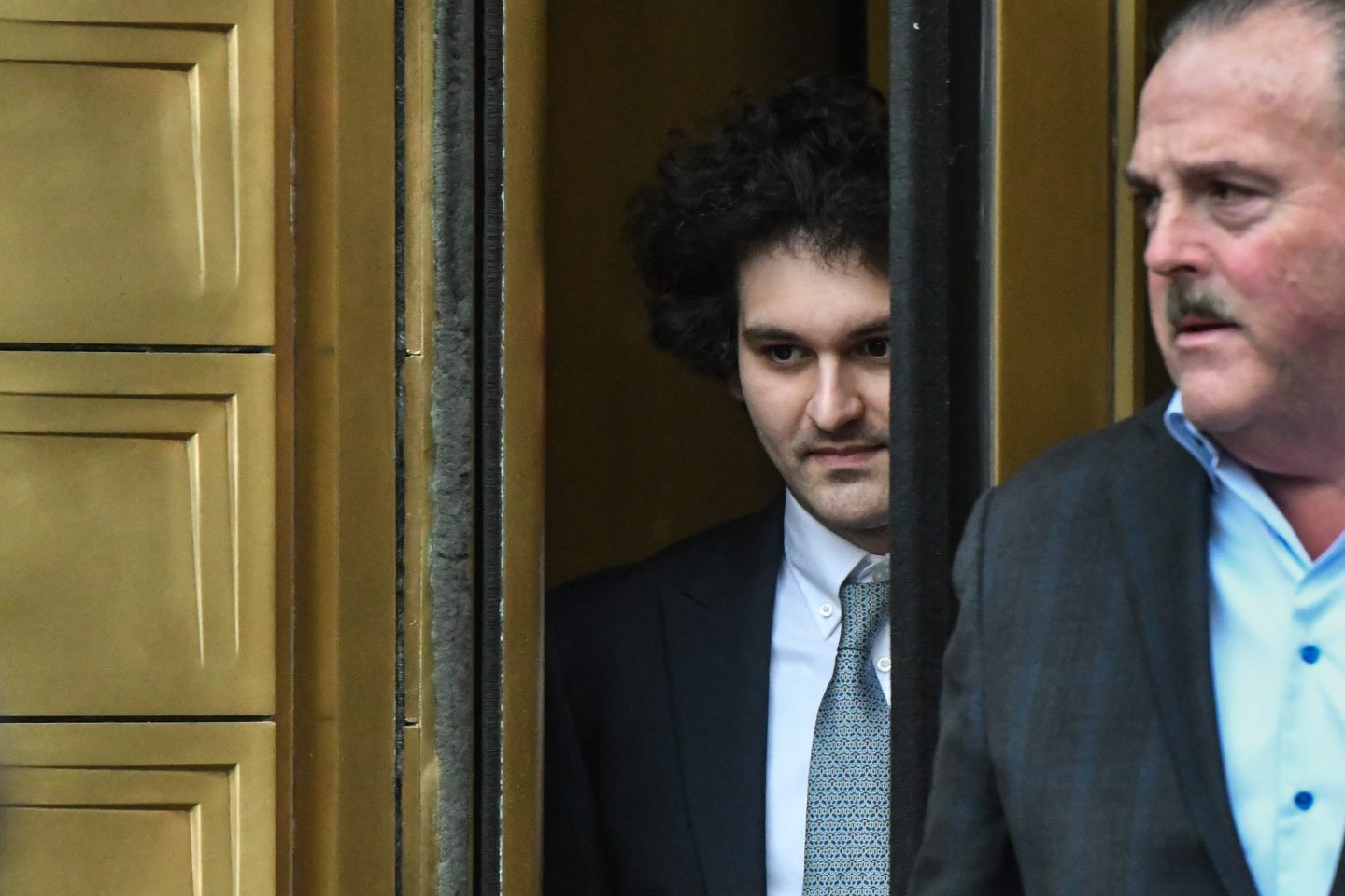 FTX founder Sam Bankman-Fried leaves court on Feb. 16, 2023.