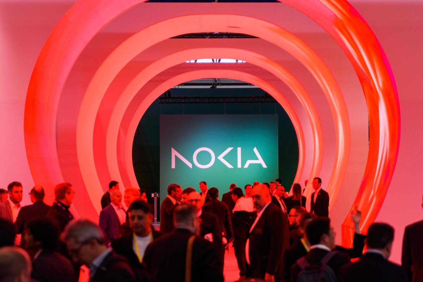 people crowding in front of a nokia logo