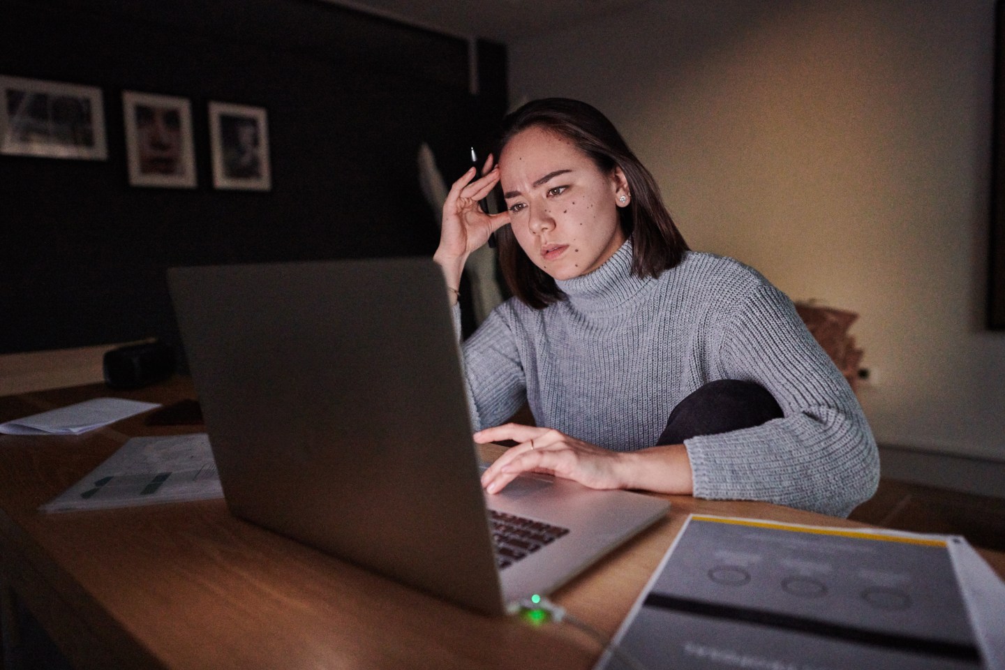 An unhappy woman on a zoom call.