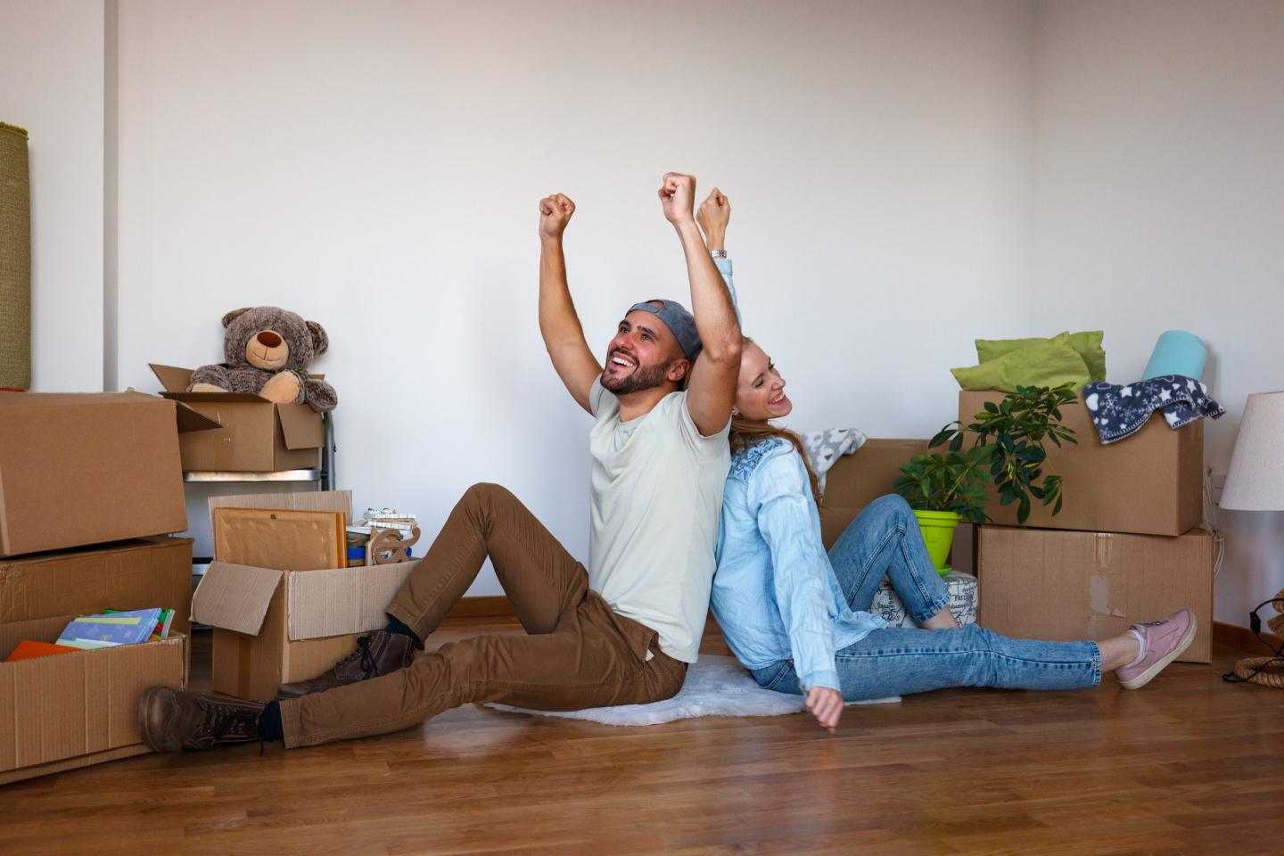 Happy couple moving into their new home