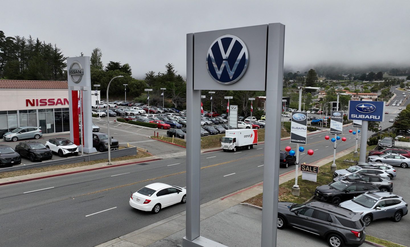 COLMA, CALIFORNIA &#8211; MAY 16: In an aerial view, cars are displayed on sales lots at a Subaru, Volkswagen and Nissan dealerships on May 16, 2023 in Colma, California. According to a report by the U.S. Commerce Department, consumer spending was up in April with help from a strong jobs market and easing inflation. Restaurants and bars saw a 0.6 percent increase in sales and retail sales were up 0.4 percent. (Photo by Justin Sullivan/Getty Images)