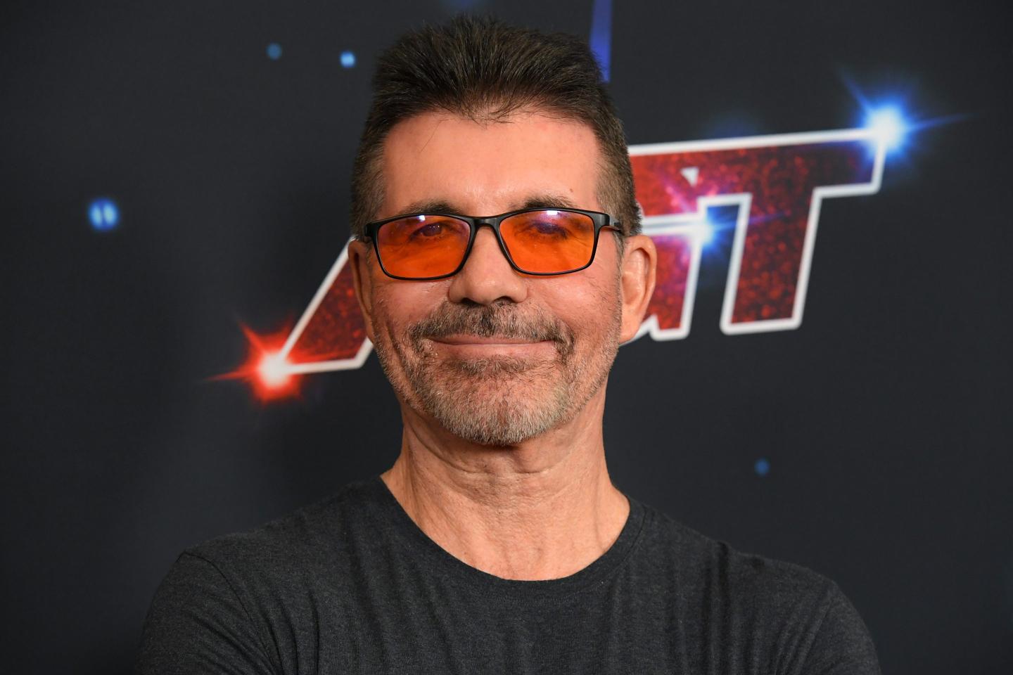 Simon Cowell posing for cameras