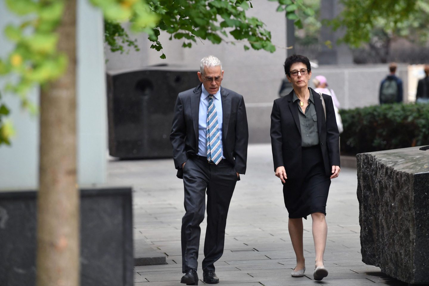 Joseph Bankman and Barbara Fried arriving at a courthouse