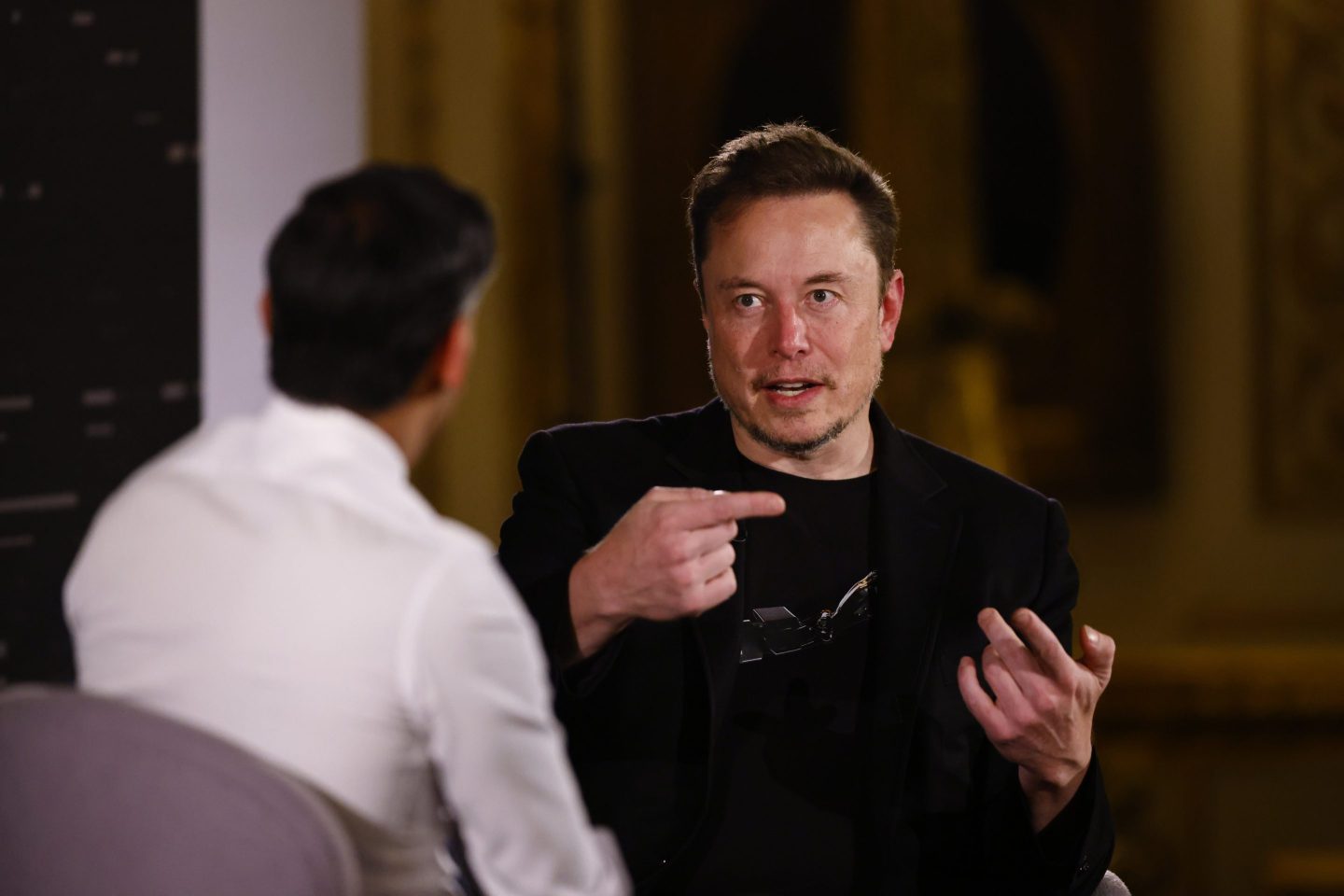 Elon Musk, chief executive officer of Tesla Inc., and Rishi Sunak, UK prime minister, left, during a fireside discussion on artificial intelligence risks in London, UK, on Thursday, Nov. 2, 2023.