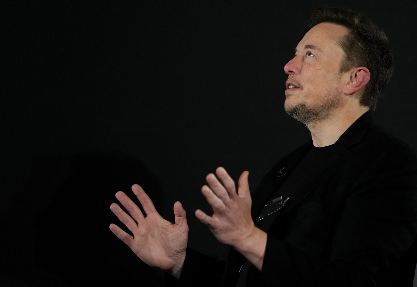 LONDON, ENGLAND &#8211; NOVEMBER 2: Tesla and SpaceX&#8217;s CEO Elon Musk gestures during an in-conversation event with British Prime Minister Rishi Sunak at Lancaster House on November 2, 2023 in London, England. Sunak discussed AI with Elon Musk in a conversation that is played on the social network X, which Musk owns.(Photo by Kirsty Wigglesworth &#8211; WPA Pool/Getty Images)