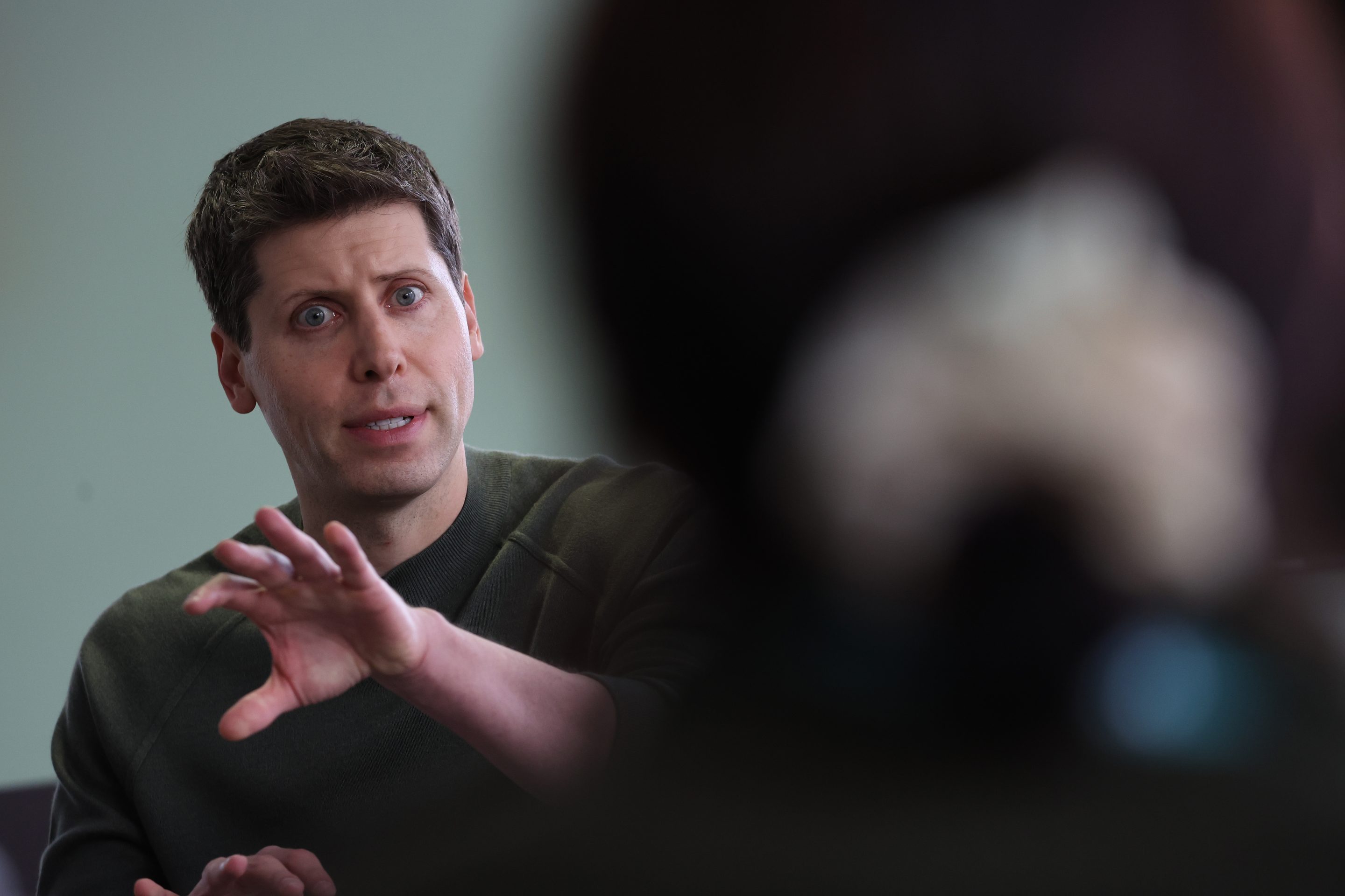 OpenAI's CEO speaking to the media on Nov. 6.