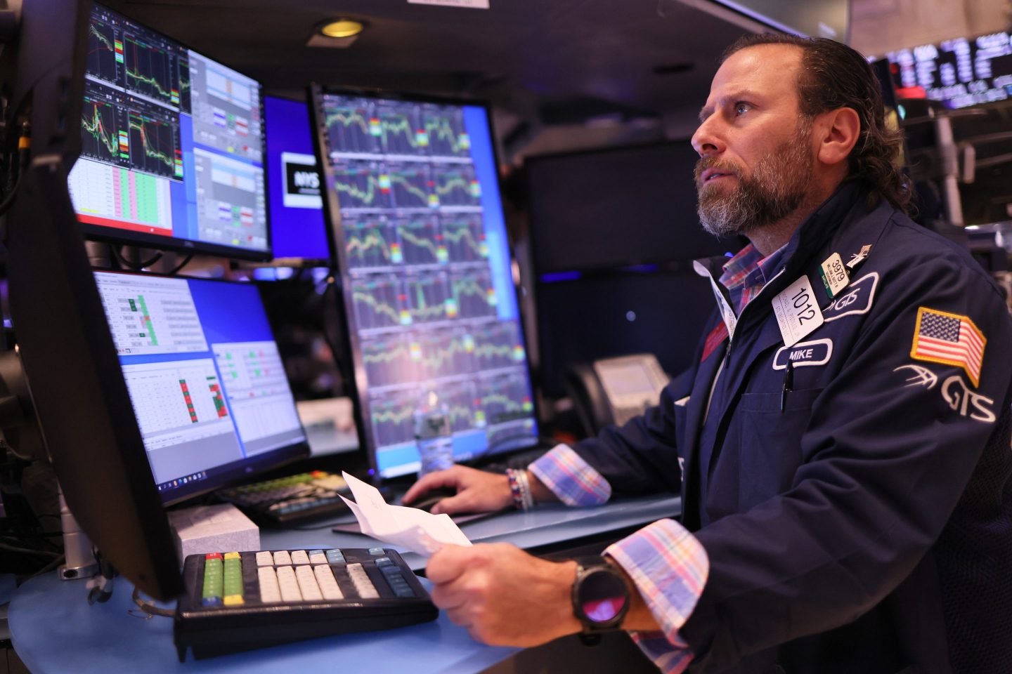 Traders work on the floor of the New York Stock exchange