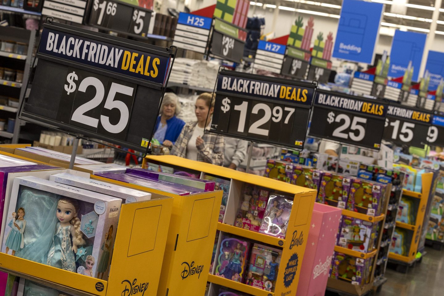 Black Friday deals line the aisles as shoppers look for bargains