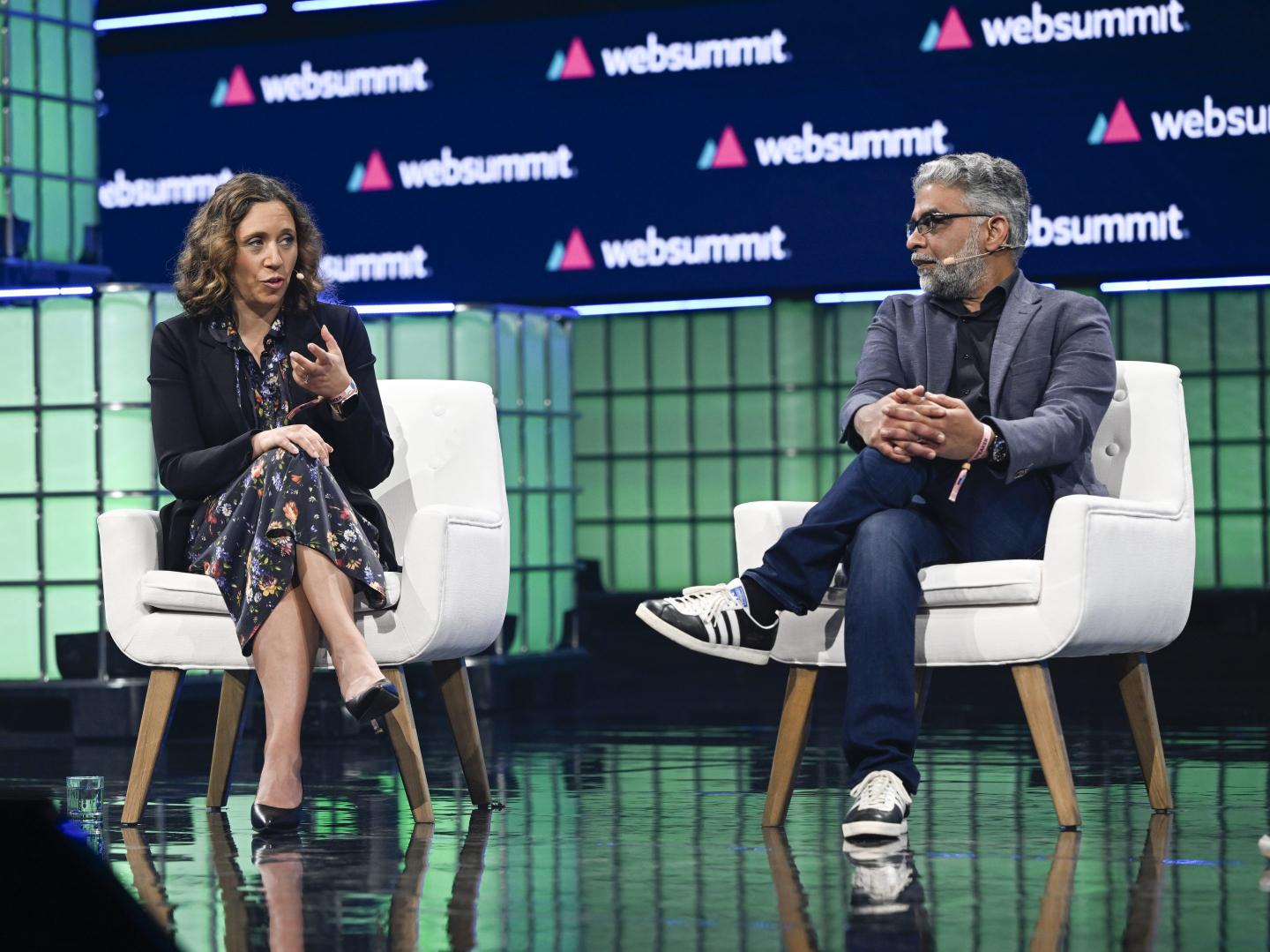 Julie Pace, Executive Editor The Associated Press, and Yasir Khan, Editor-in-chief Thomson Reuters Foundation, talk on center stage at Altice Arena on "Media literacy in the age of AI" during the second day of Web Summit on November 14, 2023 in Lisbon, Portugal.