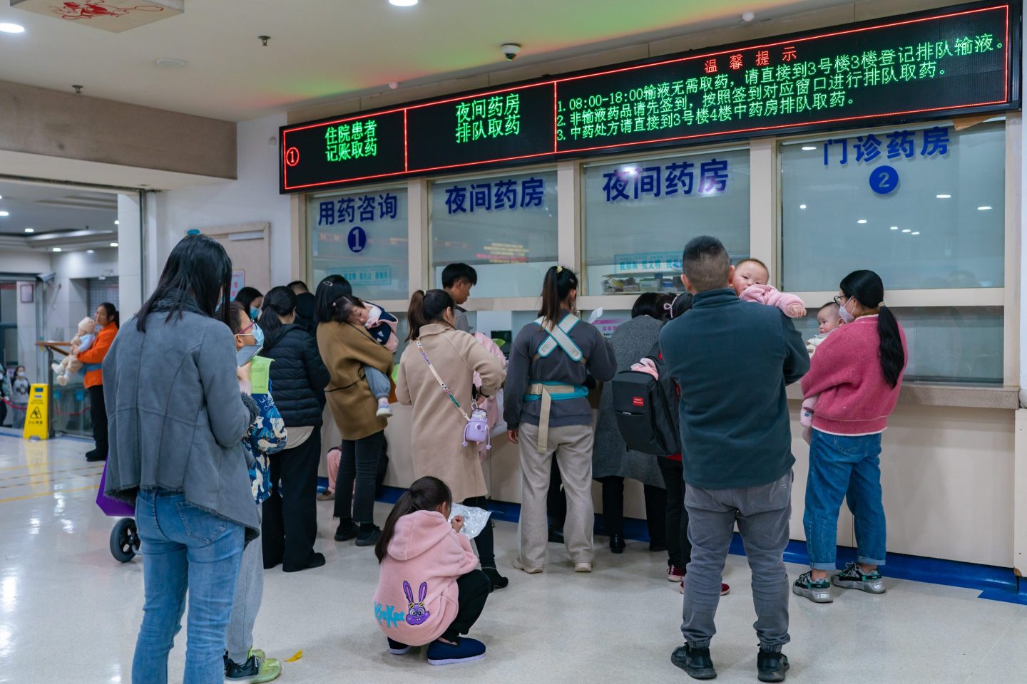 Parents with children who are suffering from respiratory diseases are lining up at a children's hospital in Chongqing, China, on Nov. 23, 2023. 