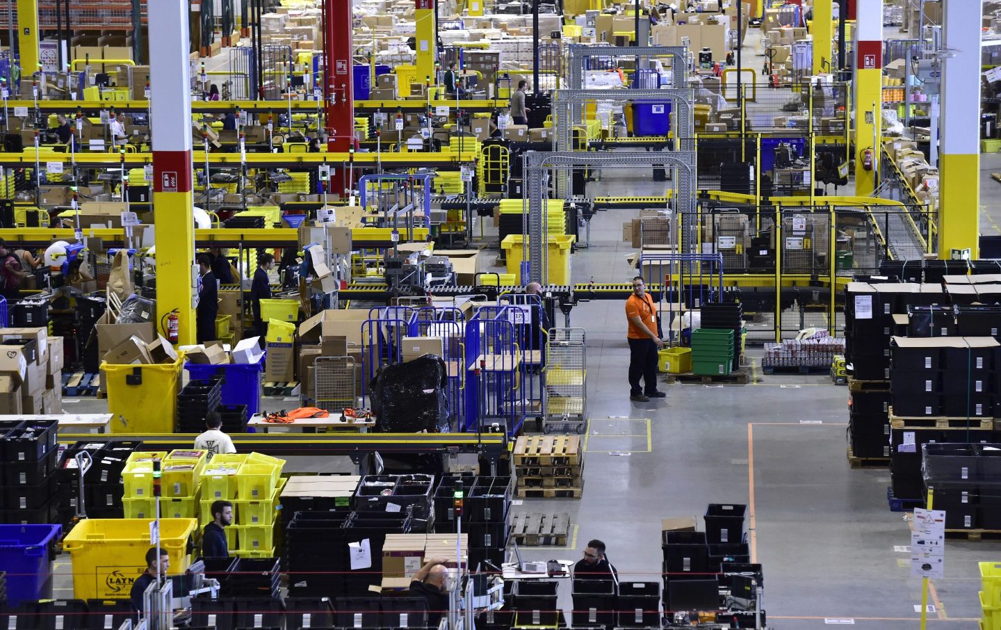 An employee works at the Amazon electronic commerce company&#8217;s logistics center in San Fernando de Henares, near Madrid, on the eve of &#8220;Black Friday&#8221;, on November 24, 2016. (Photo by GERARD JULIEN / AFP)        (Photo credit should read GERARD JULIEN/AFP via Getty Images)